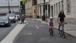 Family cycling on Lower Thames Street